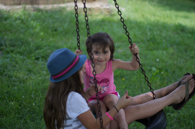 Delilah and Emma enjoying the tire swing