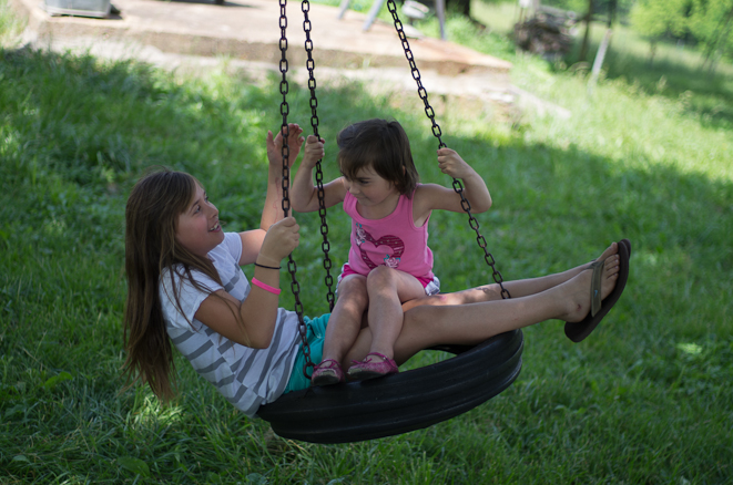 Delilah and Emma enjoying the tire swing