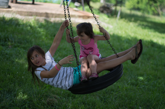 Delilah and Emma enjoying the tire swing