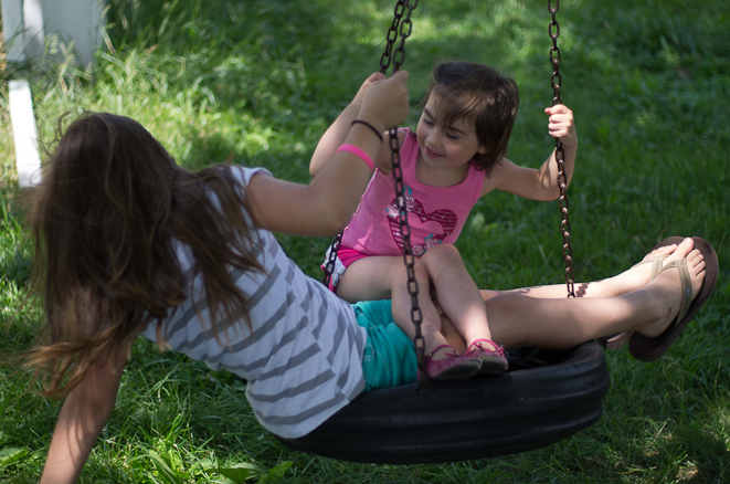 Delilah and Emma enjoying the tire swing