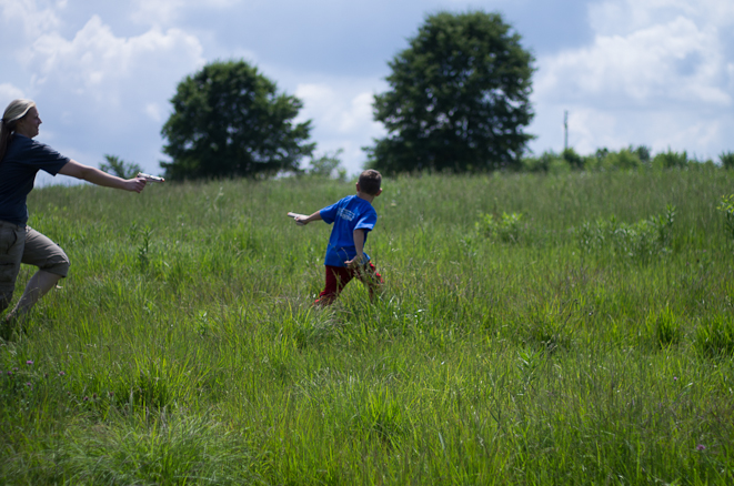 Bryce and Jennifer playing in the field