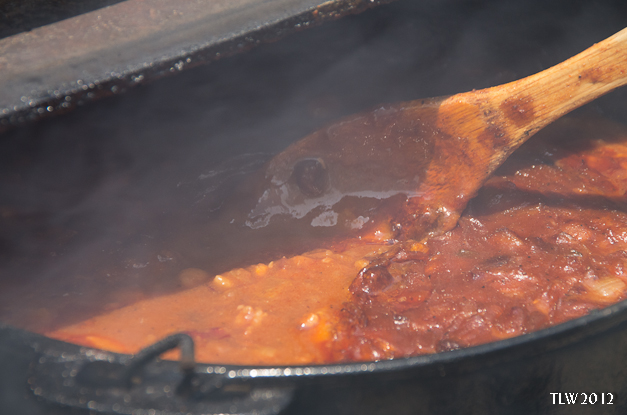 Stirring the beans.