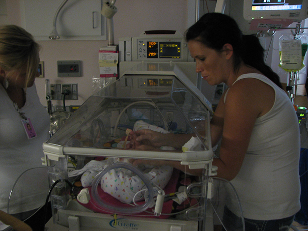 Jessica changing Caris' diaper. 