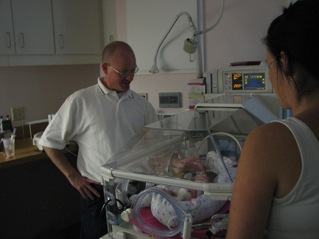 Pastor Tessaro baptizing Caris.