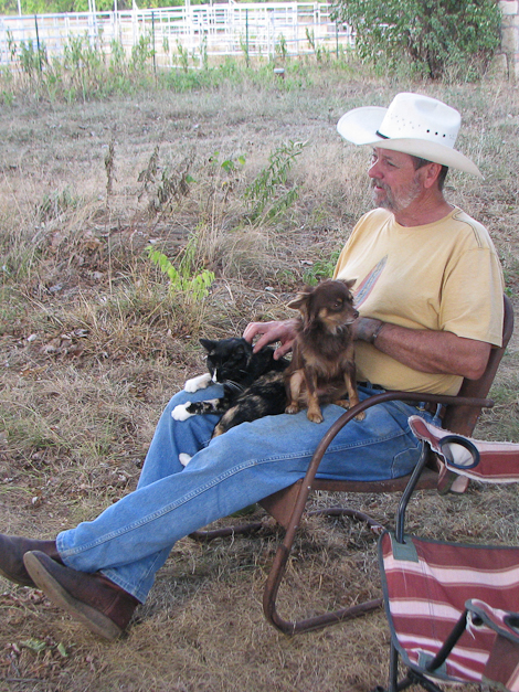 Richard giving equal attention to Sadie and Buster.